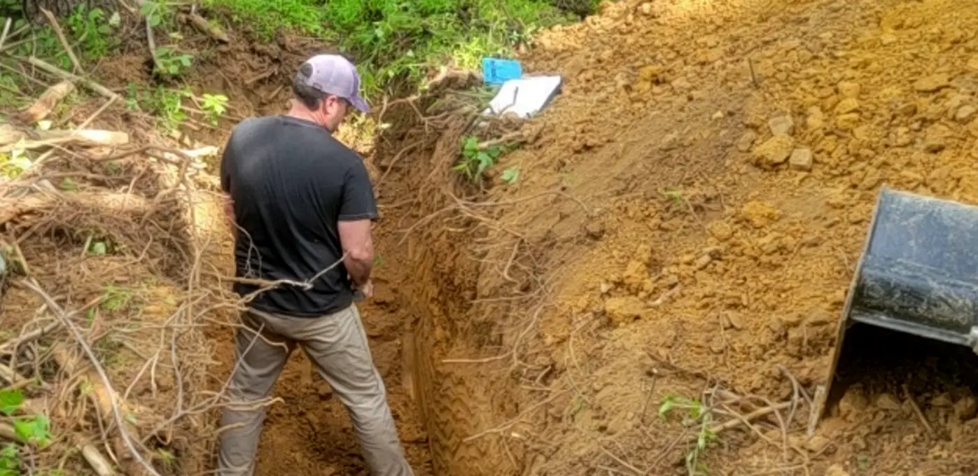 Soil scientist performing a soils study in Northern Virginia